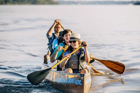 Group of kids paddling on the Mississippi River. Canoeing on the Mississippi River