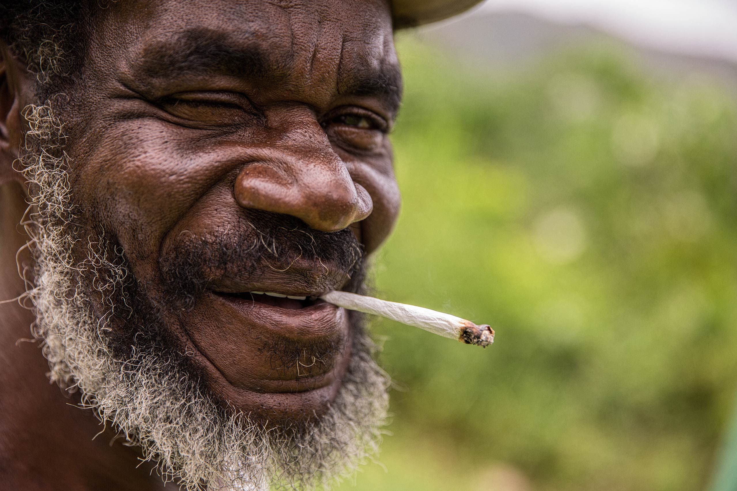 Rastafari Man in Jamaica with a Spliff