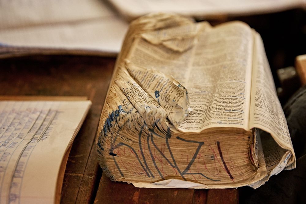 Tight photo of a very worn and old school book. WornBook.jpg