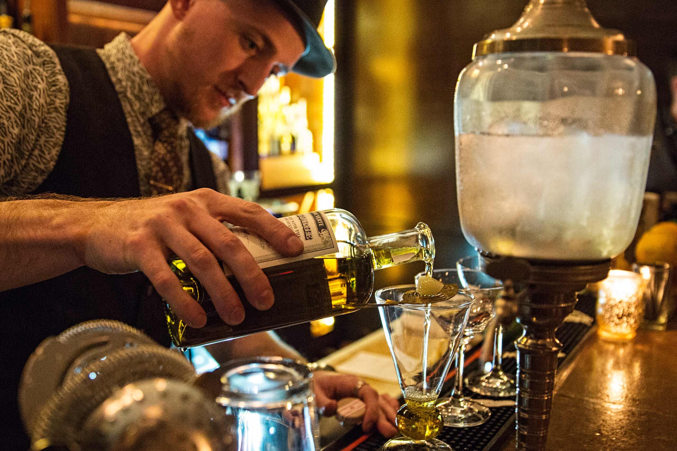 Bartender With a Fountain Pouring Absinthe