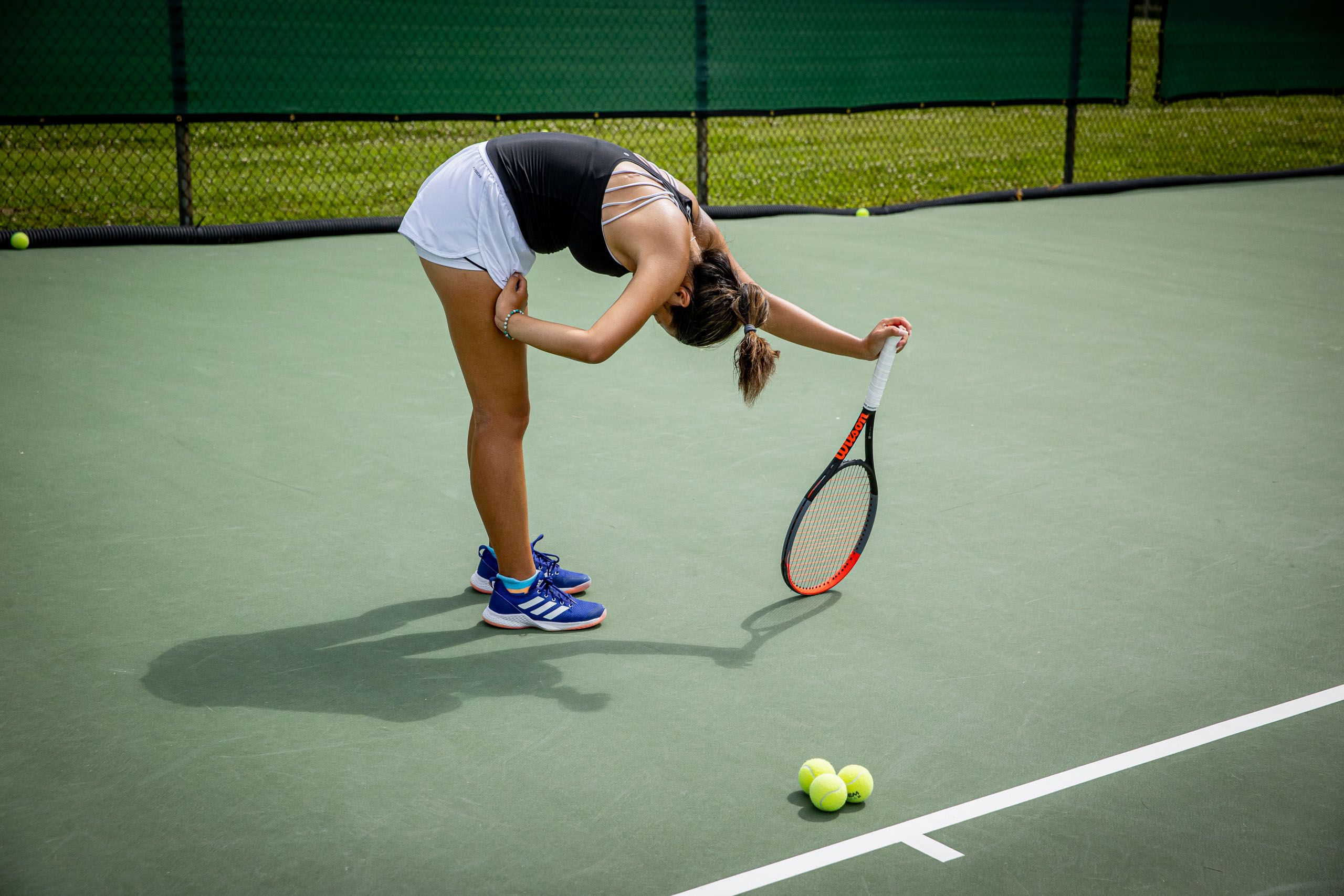 Girl Stretching Before Tennis