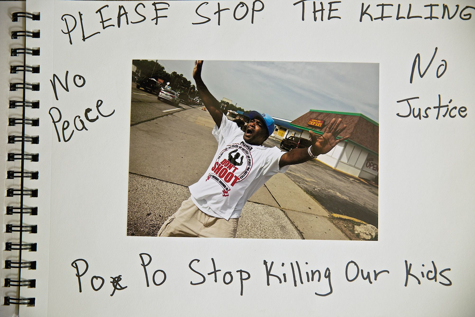 Man With His Arms Up Don't Shoot