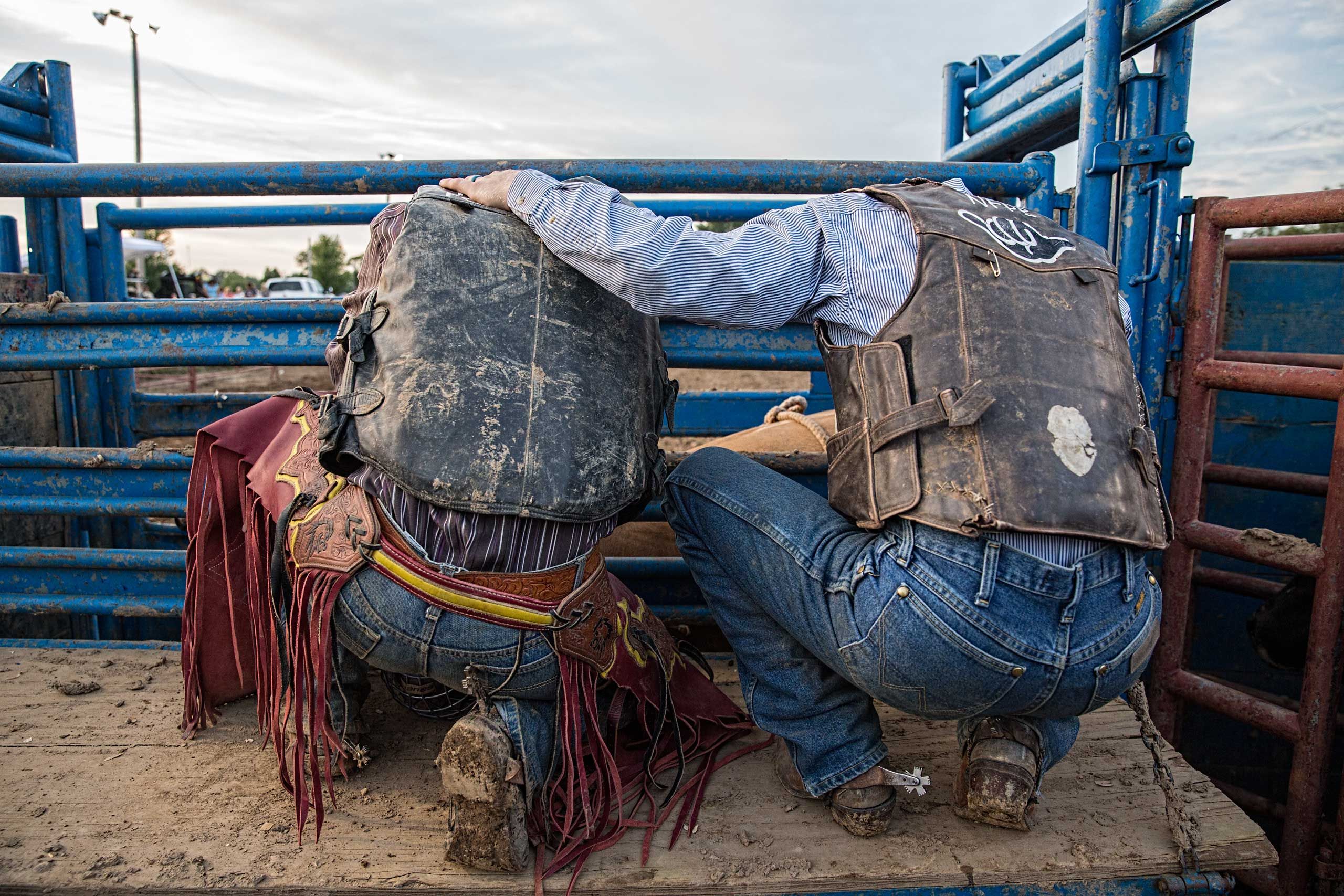 Bull Riders Praying Before a Bull Riding Competition