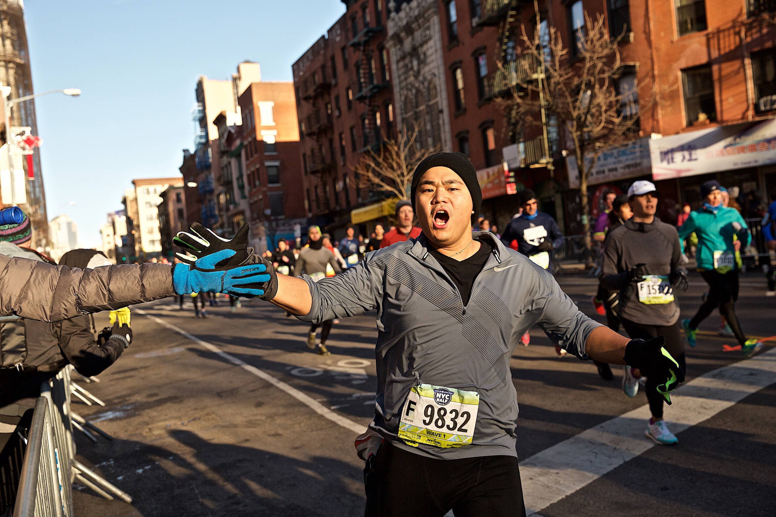 High Fives During the NYC Half Marathon in Chinatown.