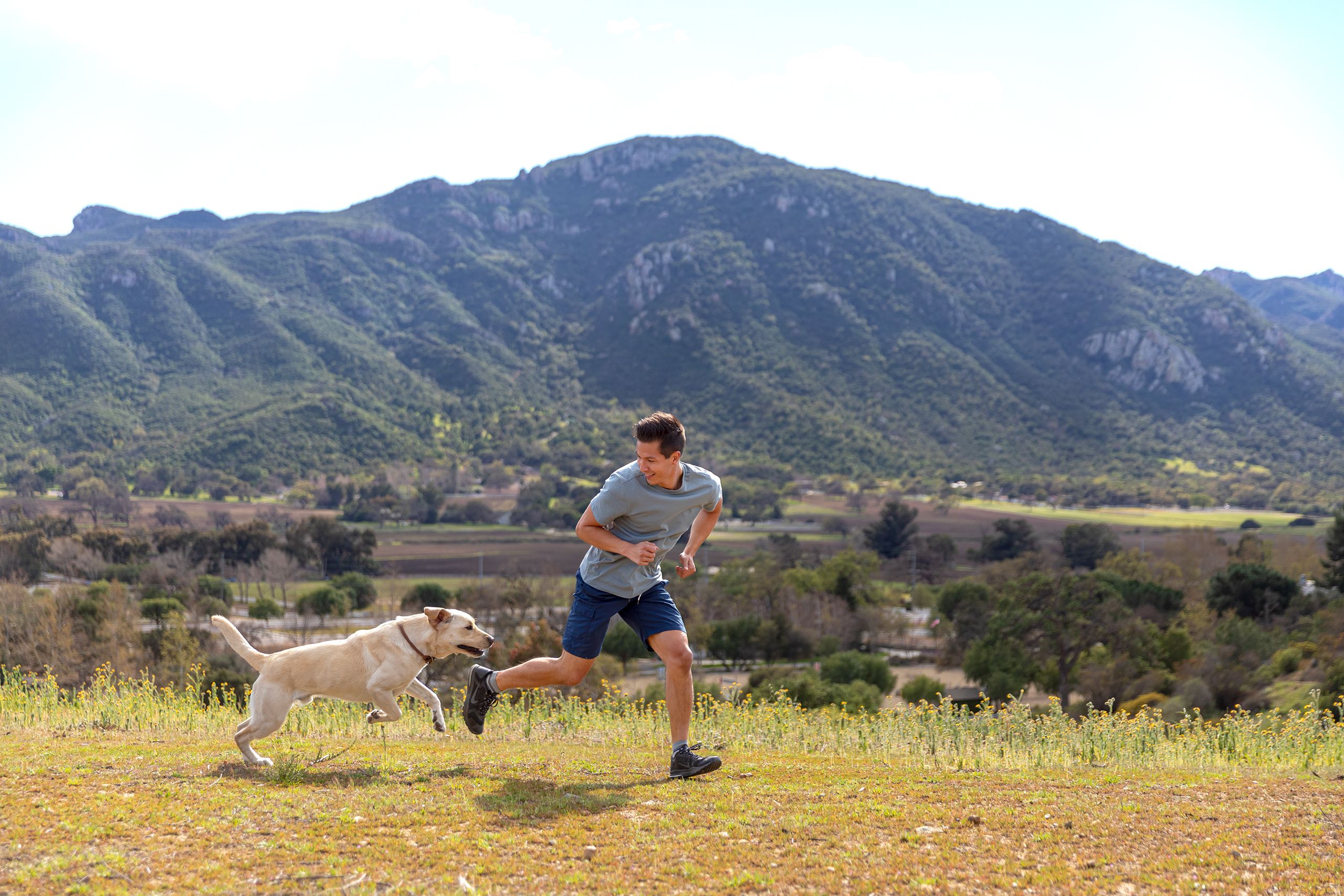 Man and Dog Jogging on a Scenic Route