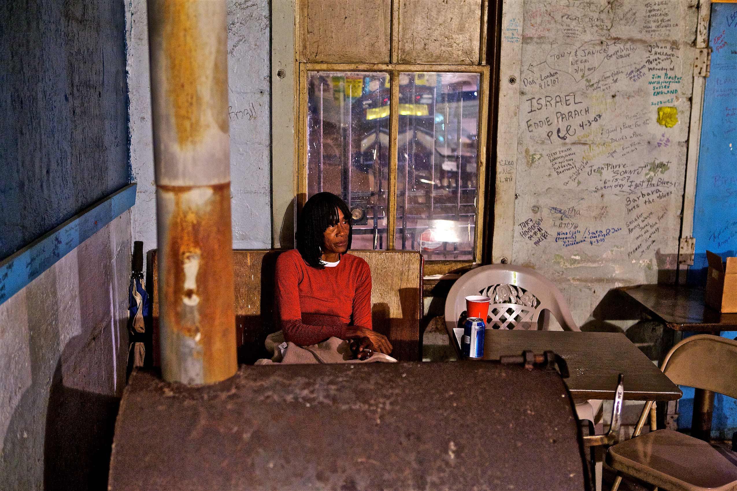 Woman Sitting Alone at The Blue Front Cafe Juke Joint