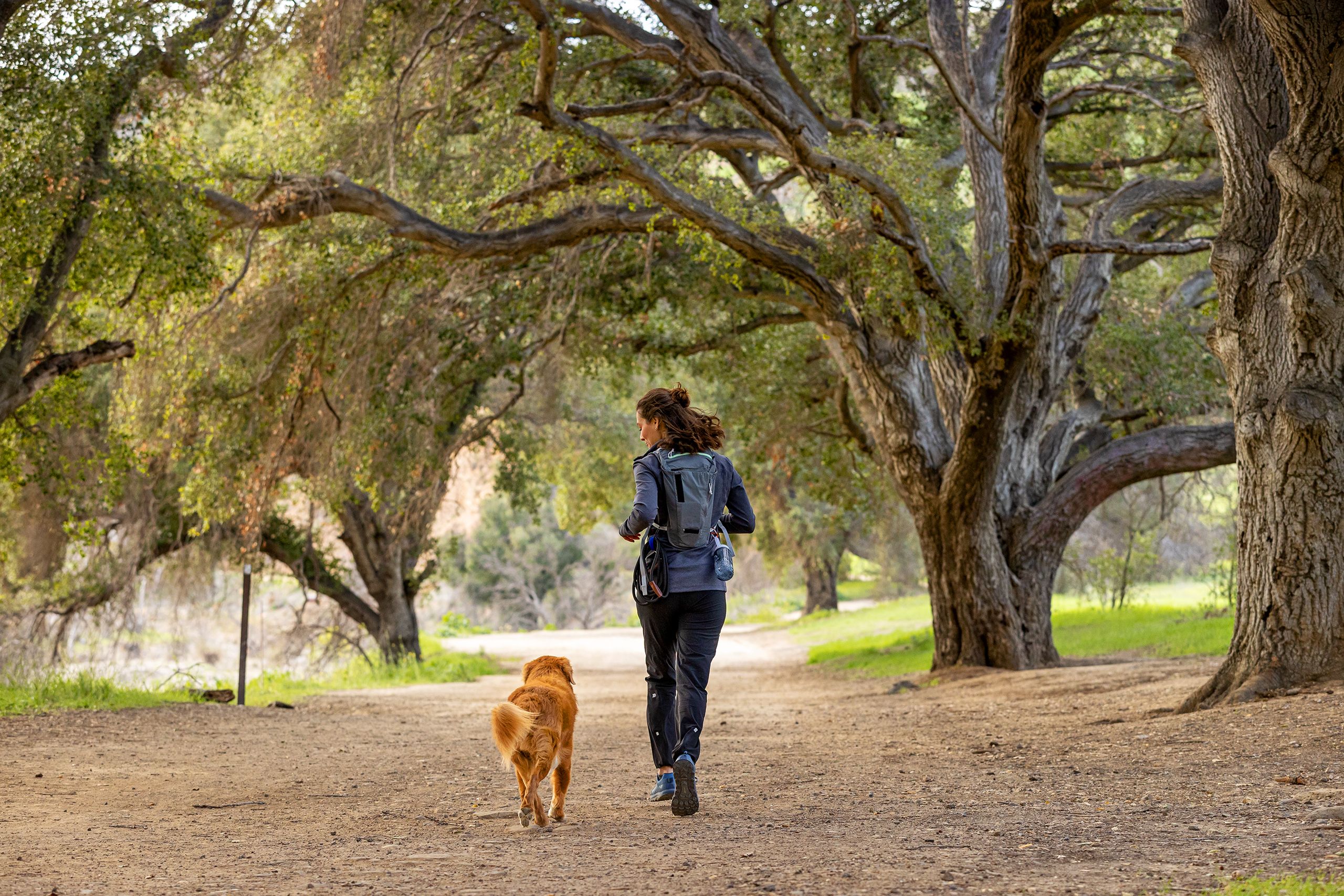 Woman Running with Dog