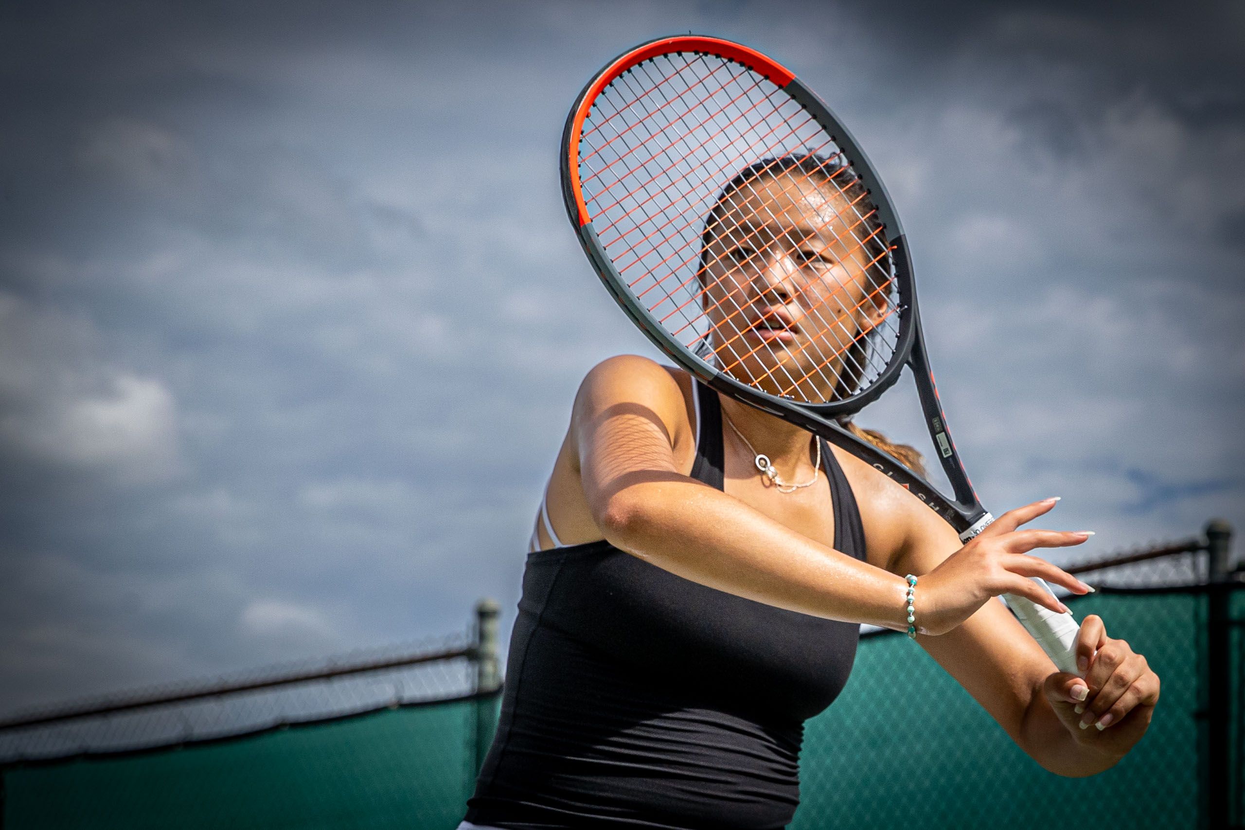 Girl Behind Tennis Racket