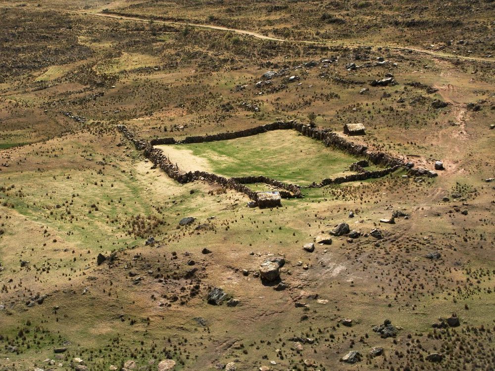 At this at over 15,000 feet altitude, raising sheep is either supreme folly or the only thing you can do. Peru. A stone pen for the sheep pen in the high Andes.