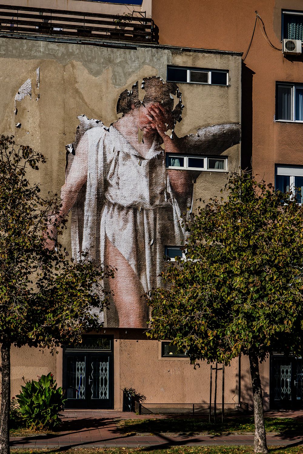 Even if you don't believe in angels this decaying paper mural seemed particularly morbid. Novi Sad, Serbia Dying angel.