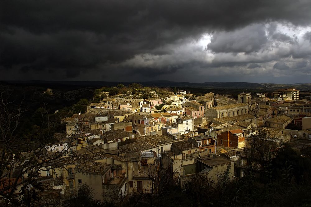 The drama of the light makes this city look a lot more appealing than it really is. Ragusa, Sicily. Even storm clouds can make a city look inviting.