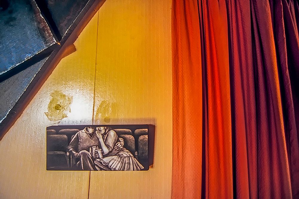 A friend's house with what seemed to be a curtain drawn back. Like looking from the screen out to the audience. Dunedin New Zealand . Theater couple.