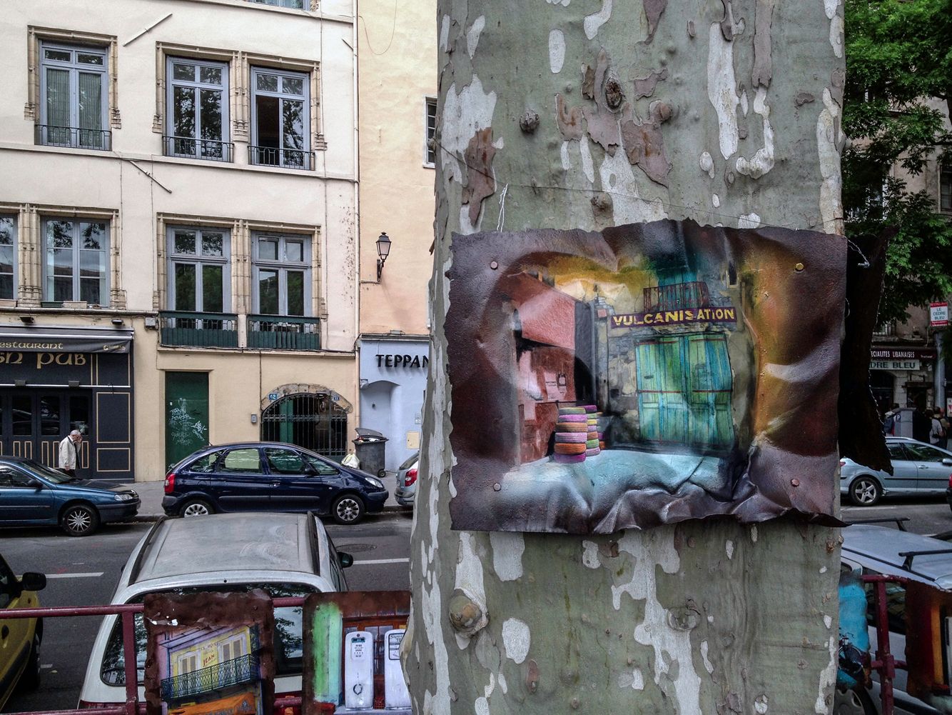 A wrinkled painting and a mottled tree.