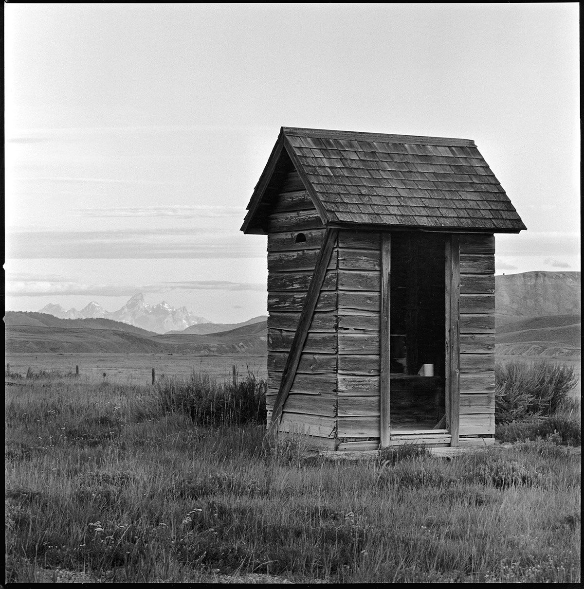 assignment photo Gros Ventre Ranch, privy, outhouse, Tetons, Grand Tetons, Wyoming, Stephen Collector, film, b&w