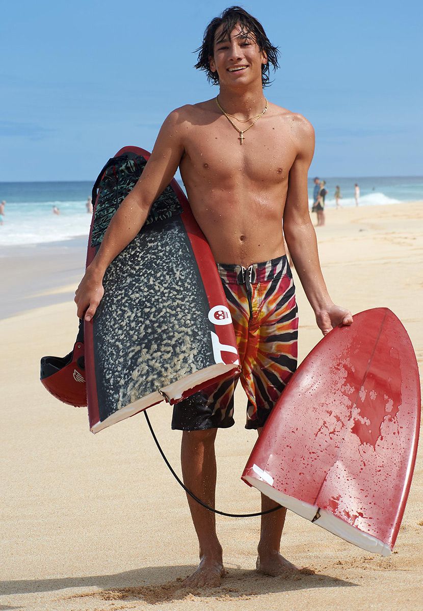 Wave broke his board. North Shore Oahu Banzai Pipeline, broken surfboard, surfer, North Shore, Oahu, portrait