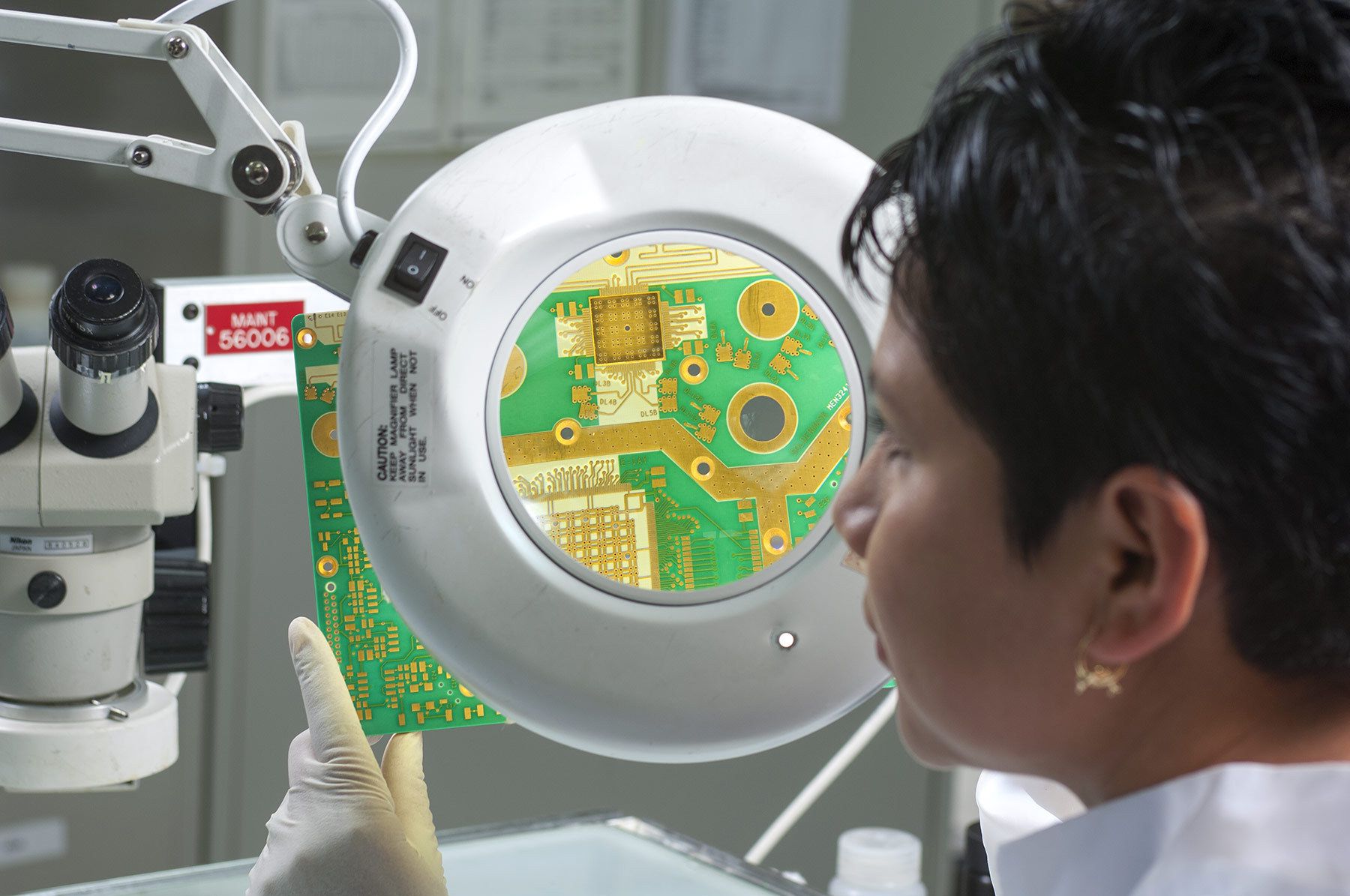 Assignment for Unicicuit in Littleton, Colorado Technician examines circuit board