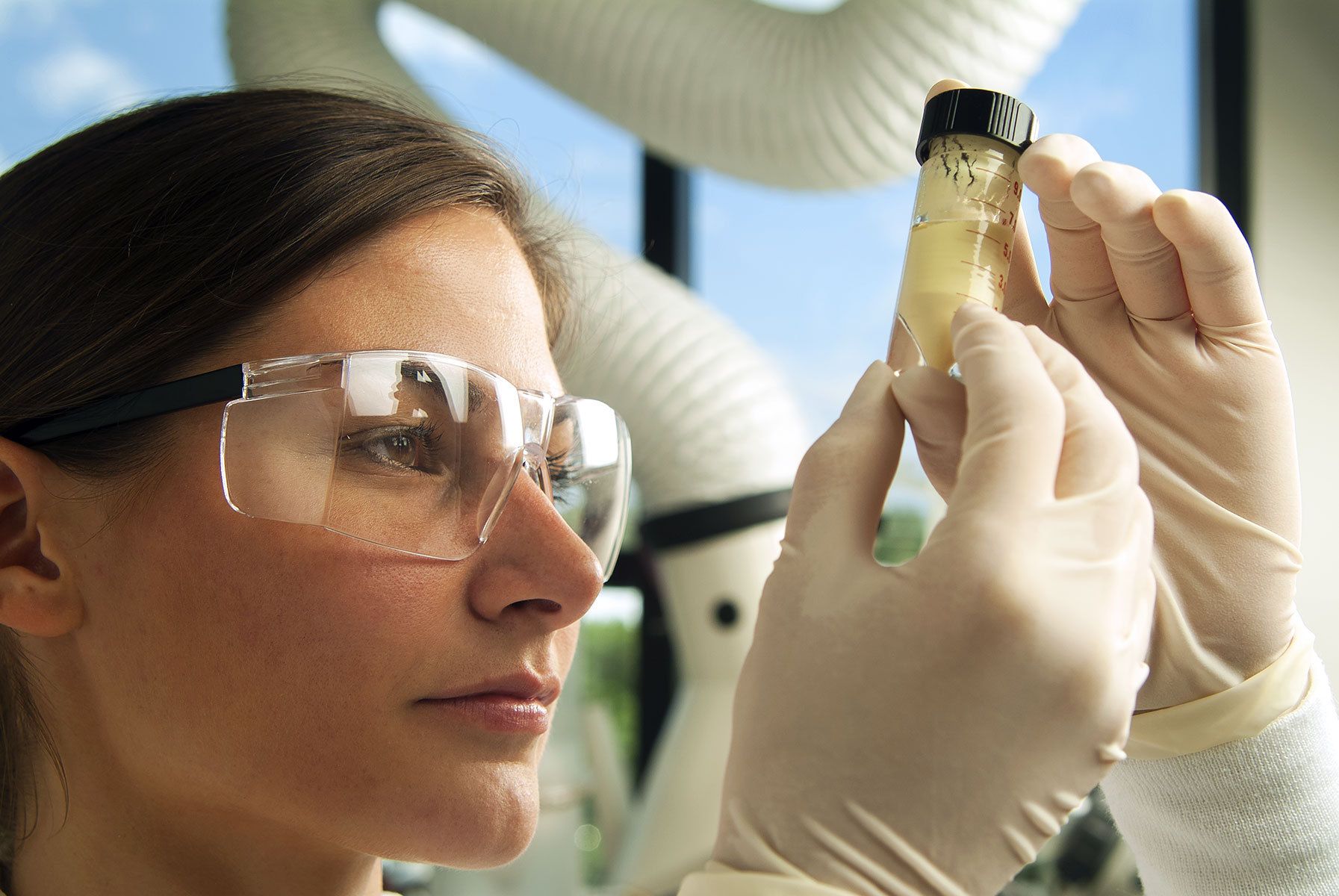 Array Biopharma Annual Report cover image Lab technician with sample