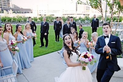 Wedding-Bridal-party-pops-Champagne-at-photographer-and-hits-camera-by-accident.jpg