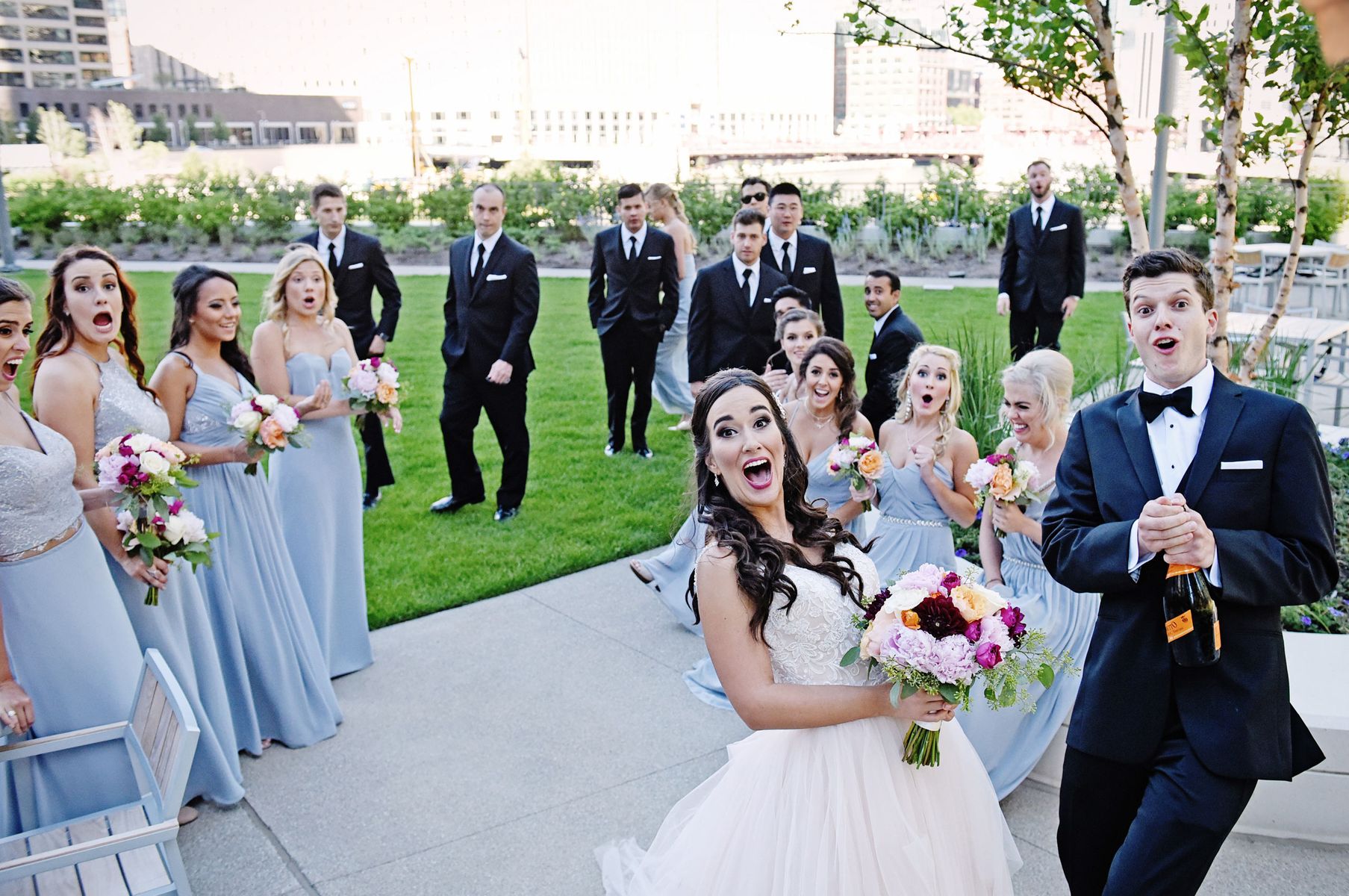 Wedding-Bridal-party-pops-Champagne-at-photographer-and-hits-camera-by-accident.jpg