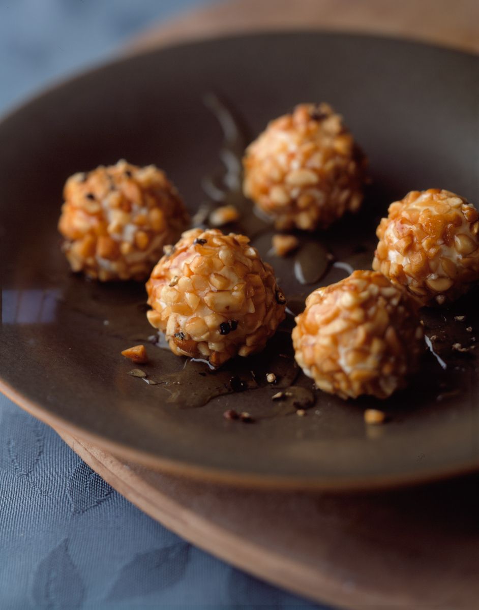 Goat cheese balls with almonds in brown plate Deen Brotherswww.rkjacobs.comRobert Jacobs Photography ©2013 Top Food Photographer New York Seattle Portland