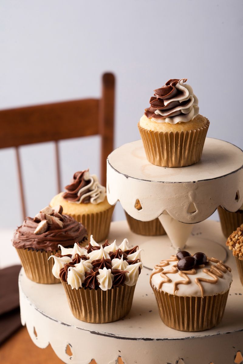 Fancy Chocolate frosted cupcakes on a rustic tiered standwww.rkjacobs.com MidWest Livng, MeredithTop Food Photographer New York Seattle PortlandRobert Jacobs Photography ©2013 Fancy Chocolate frosted cupcakes on a rustic tiered standwww.rkjacobs.com MidWest Livng, MeredithTop Food Photographer New York Seattle PortlandRobert Jacobs Photography ©2013
