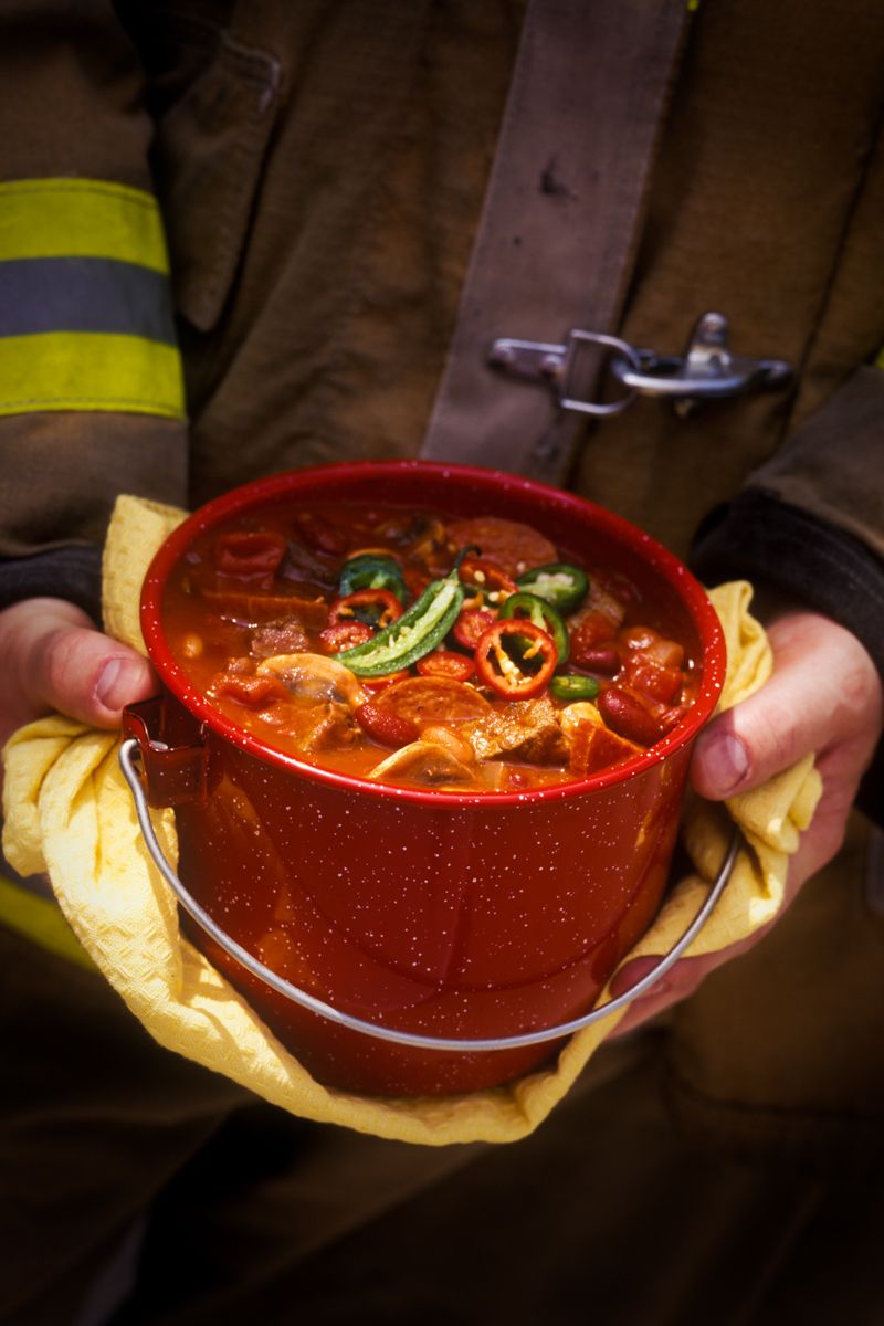 Firehouse Chili, Fireman holding bowl of chili in red bucket www.rkjacobs.comTop Food Photographer New York Seattle PortlandRobert Jacobs Photography ©2013 Firehouse Chili, Fireman holding bowl of chili in red bucket www.rkjacobs.comTop Food Photographer New York Seattle PortlandRobert Jacobs Photography ©2013