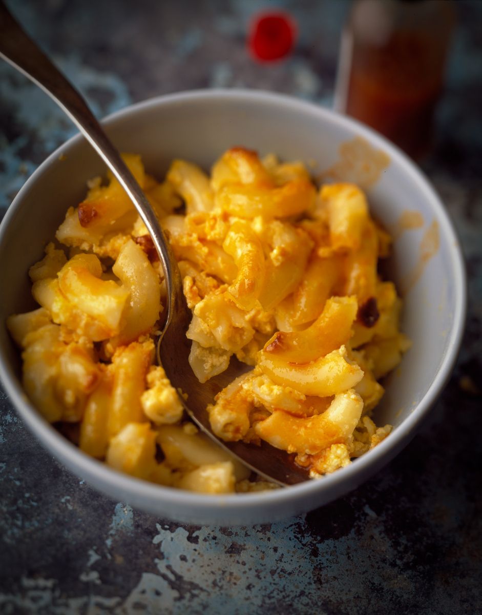 Macaroni and cheese in bowl on rustic tin surface   www.rkjacobs.com  Deen Brothers top food photographer New York Seattle Portland Robert Jacobs photography ©2013
