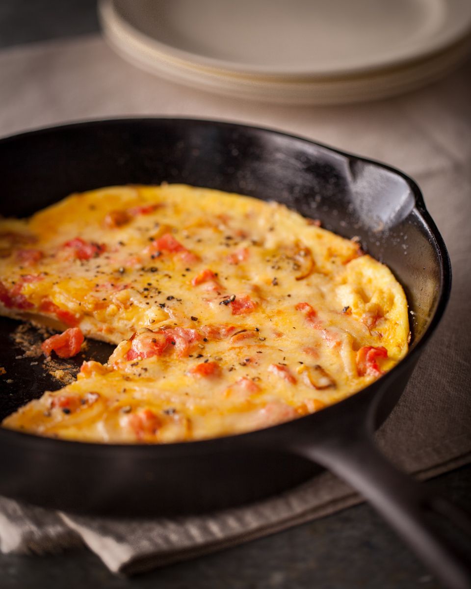frittata in cast iron pan with plates    www.rkjacobs.com  Mark Bittman New York Times top food photographer New York Seattle Portland Robert Jacobs photography ©2013