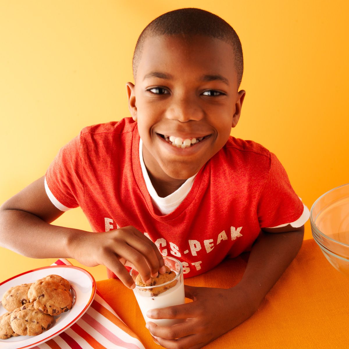 Young african american boy with chocolate chip cookies and glass of milk  dunking cookie for Food Networks Kitchen's "How to Boil Water" cookbookboy w/cookies 0002 www.rkjacobs.comTop Food Photographer New York Seattle PortlandRobert Jacobs Photography ©2013 Young african american boy with chocolate chip cookies and glass of milk dunking cookie for Food Networks Kitchen's "How to Boil Water" cookbookwww.rkjacobs.comTop Food Photographer New York Seattle PortlandRobert Jacobs Photography ©2013