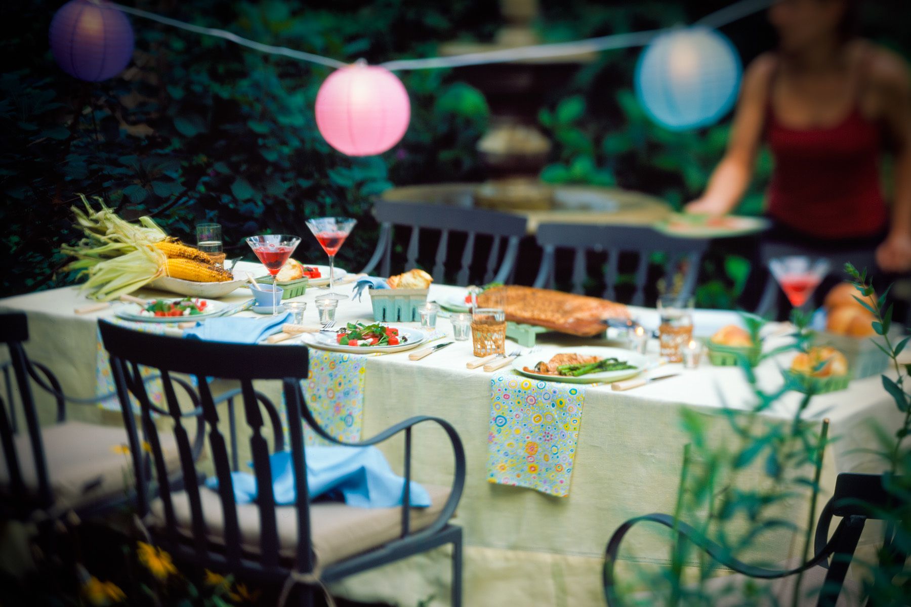 young woman preparing garden party table in summer time garden with cosmopolitans, mexican grilled corn Food Network Kitchens "Grilling"Cookbookwww.rkjacobs.comTop Food Photographer New York Seattle PortlandRobert Jacobs Photography ©2013 young woman preparing garden party table in summer time garden with cosmopolitans, mexican grilled corn Food Network Kitchens "Grilling"Cookbookwww.rkjacobs.comTop Food Photographer New York Seattle PortlandRobert Jacobs Photography ©2013