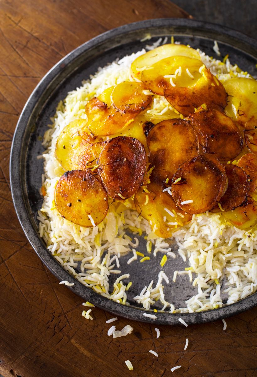 scalloped potatoes with jasmine rice on tin tray on rustic wooden table  www.rkjacobs.com  Robert Jacobs Photography ©2013New York Times Mark Bittman