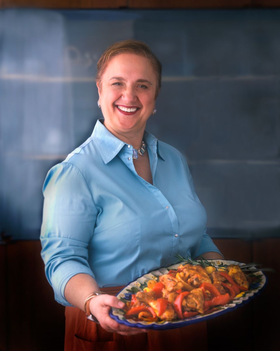 Lidia Bastainich holding platter of pasta with pepperswww.rkjacobs.comRobert Jacobs Photography ©2013 Top Food Photographer New York Seattle Portland