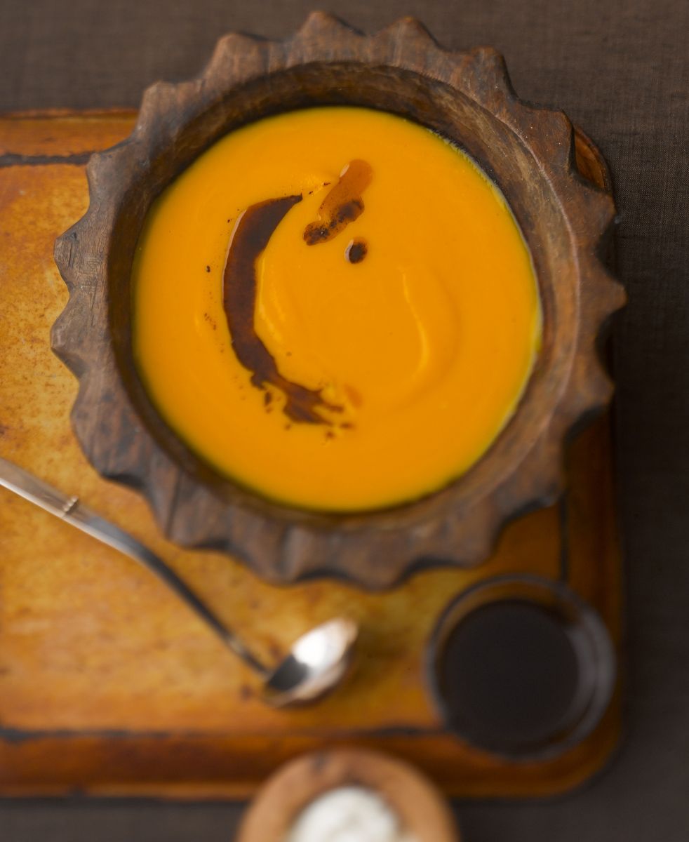 Squash soup in dark rustic bowl on rusted tray with salt  www.rkjacobs.comRobert Jacobs Photography ©2013 G.Garvinwww.rkjacobs.com