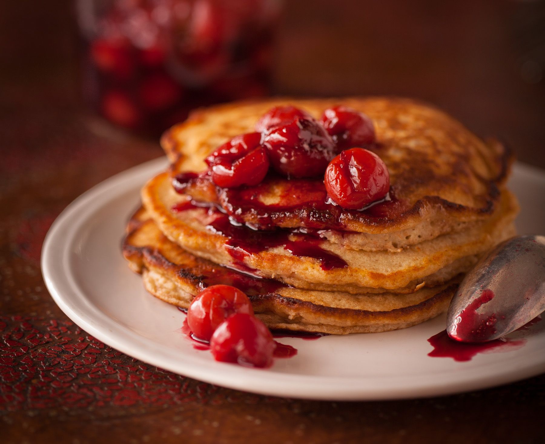 Whole grained pankcakes with stwed cherries on wooden table New York Times Mark Bittman's app. "How to Cook Everything"www.rkjacobs.comTop Food Photographer New York Seattle PortlandRobert Jacobs Photography ©2013 Whole grained pankcakes with stwed cherries on wooden table New York Times Mark Bittman's app. "How to Cook Everything"www.rkjacobs.comTop Food Photographer New York Seattle PortlandRobert Jacobs Photography ©2013