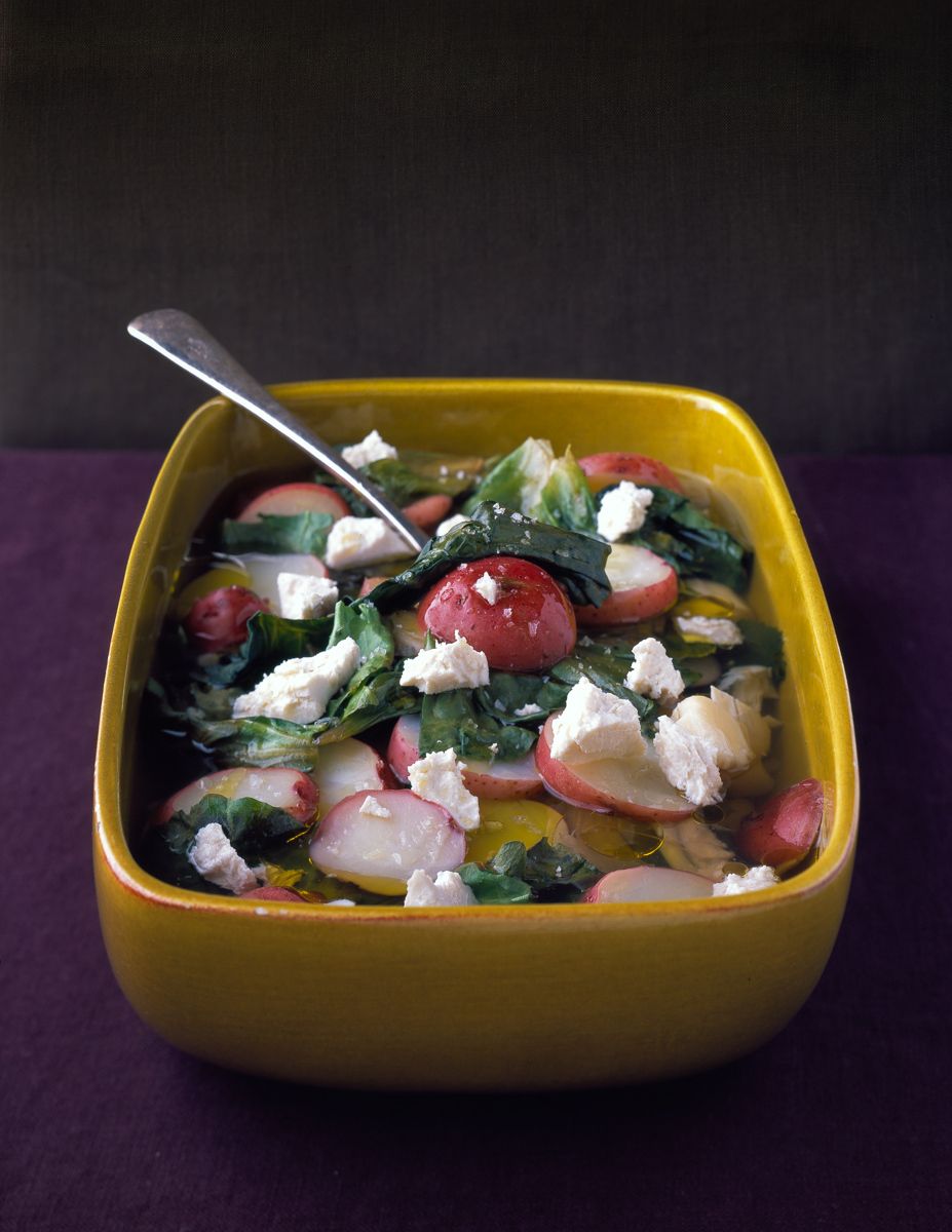 Escarole in stone rectangle serving dish potatoes and cheese  www.rkjacobs.comtop food photographer New York Seattle Portland Robert Jacobs photography ©2013