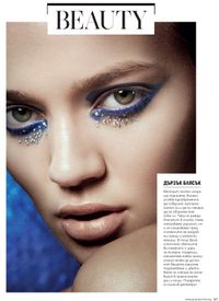 Beauty photograph of model in blue glitter make up. for beauty opener editorial for Grazia Magazine