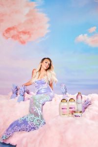 Photo of Influencer Kandee Johnson as mermaid o cotton candy cloud for OGX shampoo Campaign