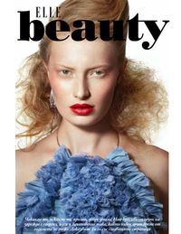 Beauty Opener editorial Elle Magazine, redhead model with blue ruffle top