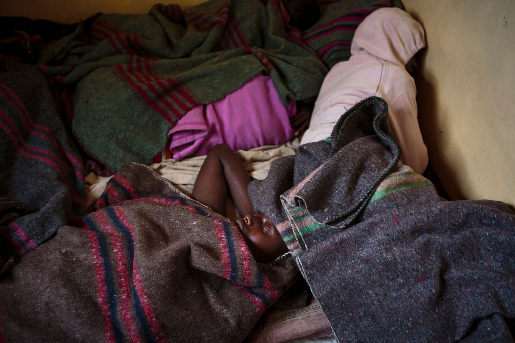 Four girls sleep alongside each other at the safe house, which provides only basic living essentials. Three small bedrooms accommodate about 10 girls apiece every night. 11.jpg