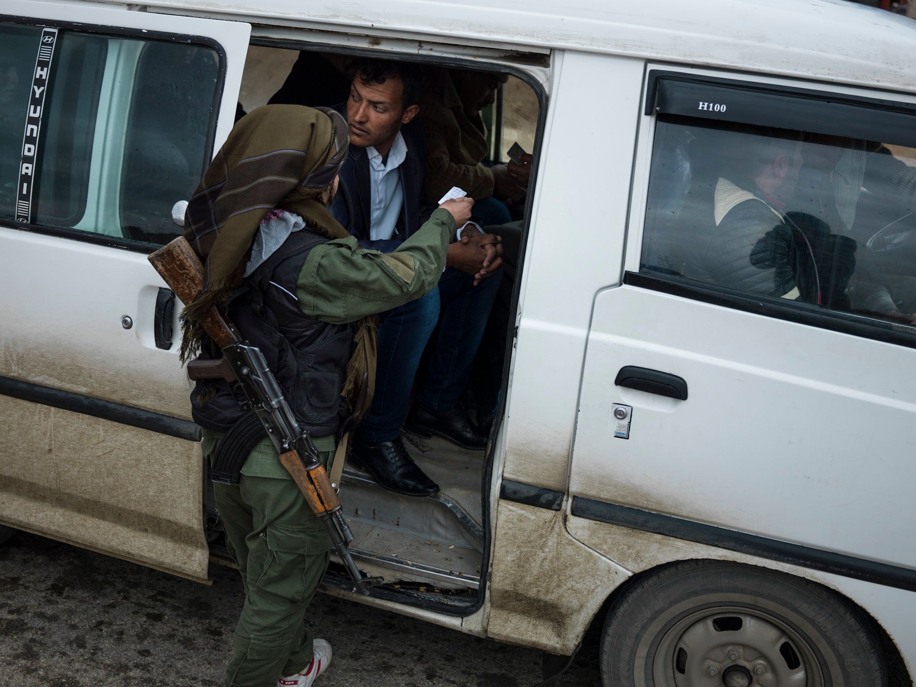YPJ soldiers at the checkpoint, where identity of the passengers is monitored, as a precautionary measure to prevent any infilteration by ISIS members. 13.jpg