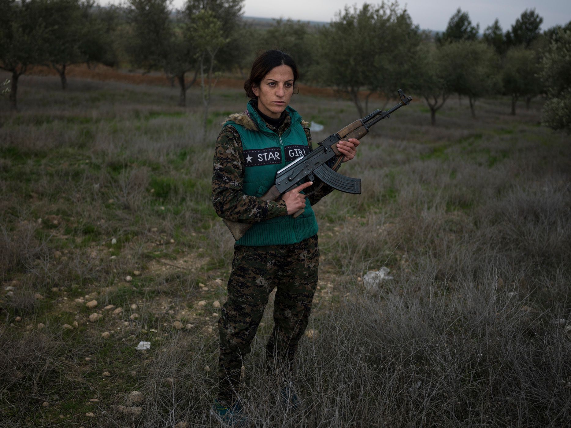 Saria Zilan, 18, from Amuda."It's been one year and four months since I joined YPJ. When I saw Martyr Deli on TV after ISIS beheaded her, I went to her burial ceremony the next day in Amuda. I saw Deli's mother sobbing madly. Right there I swore to myself to avenge her death. I joined YPJ the day after. In the past, women had various roles in the society. but all those roles were taken from them. We are here now to take back the role of women in society. I grew up in a country, where I was not allowed to speak my mother tongue of Kurdish. I was not allowed to have a Kurdish name. If you were a pro-Kurdish activist, they'd arrest you and put you in jail. But since the Rojava revolution, we have been getting back our rights. We were not allowed to speak our language before, and now ISIS wants to wipe us off completely from the Earth. I fought with ISIS in Serikani. I captured one of them and wanted to kill him, but my comrades did not let me do so. He kept staring at the ground and would not look at me, because 28.jpg