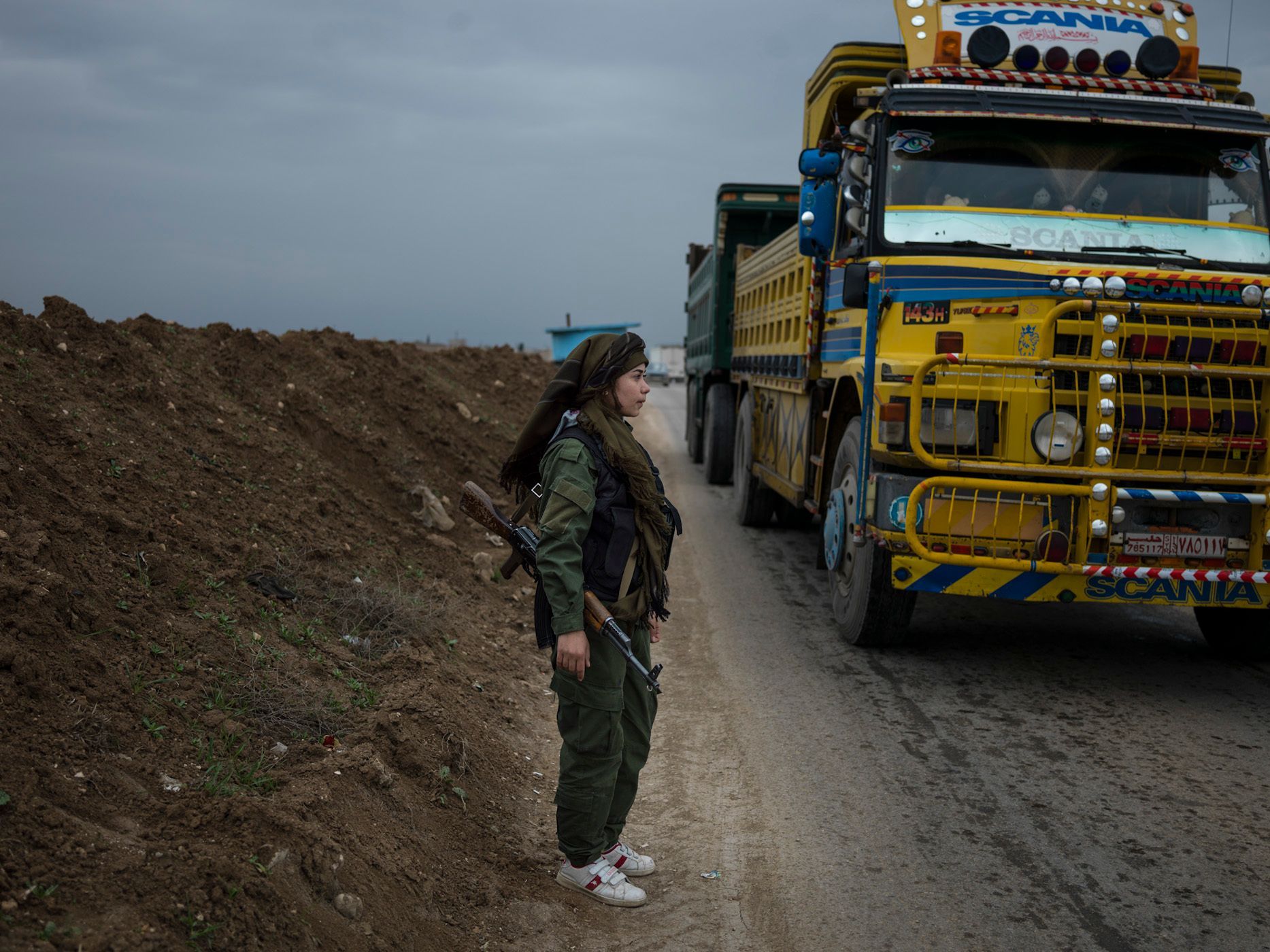 YPJ soldiers at the checkpoint, where identity of the passengers is monitored, as a precautionary measure to prevent any infilteration by ISIS members. 27.jpg