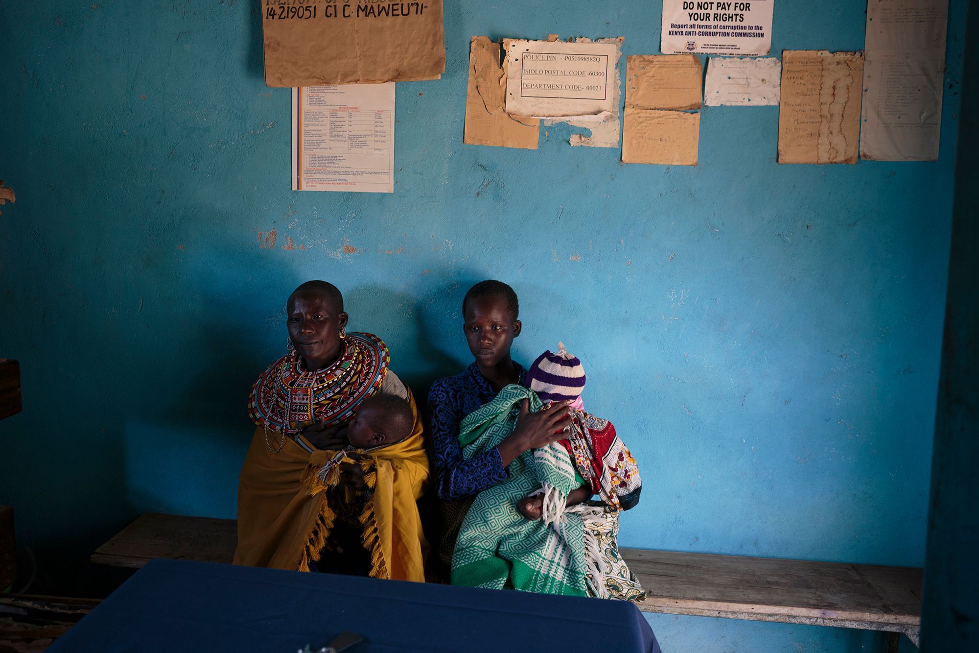 A group of young girls rescued by the Samburu Girls Foundation wait at the local police station en route to their safe house. The two youngest girls (right) were escorted by their grandmother, who wanted to protect them from FGM as the ceremony was being prepared for the following day. 17.jpg