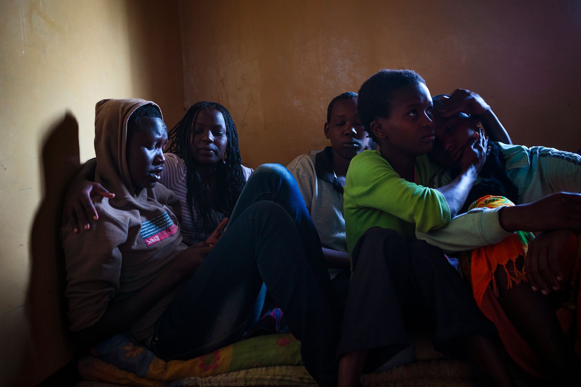Generica, 16 (left), spent her first hours at the safe house in tears. She and Naserian, 15 (right), arrived the same day to warmth and empathy provided by the other residents. The girls’ emotional states regularly fluctuate between joy at their new found protection and sadness due to trauma and separation from their loved ones at such young ages. 14.jpg