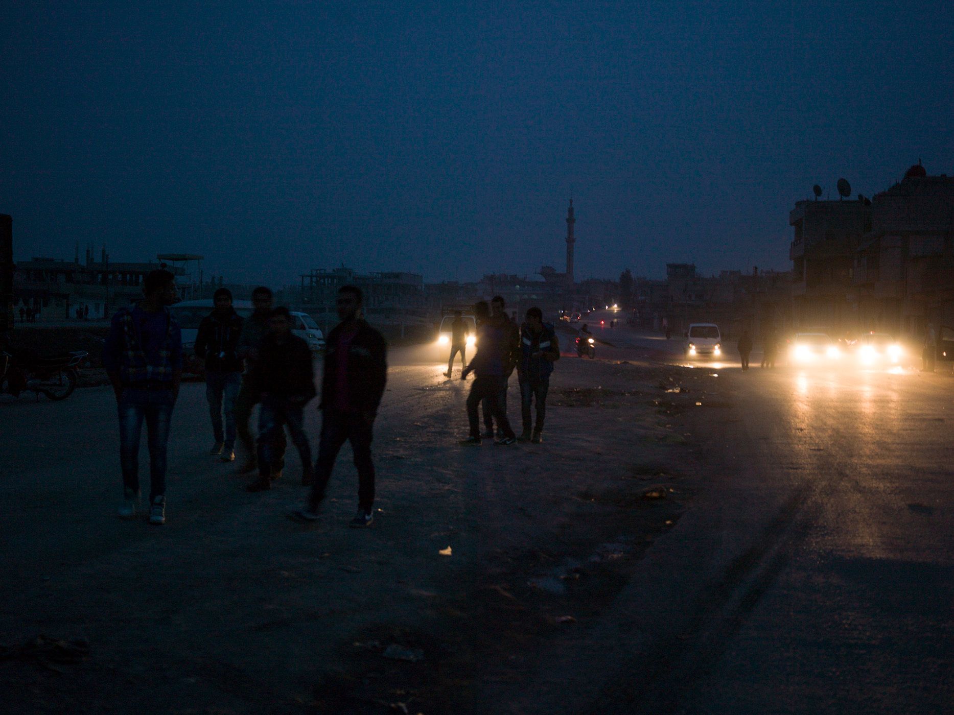 The view of a Derek town street during a PYD promotional call for new members for YPJ and YPG. The megaphone played revolutionary music and the speaker kept talking about the freedom spirit and the Kurdish democracy. Many young people of Rojava are jobless and their only hobby is coming out to hear the promotional speeches in the afternoon. 26.jpg