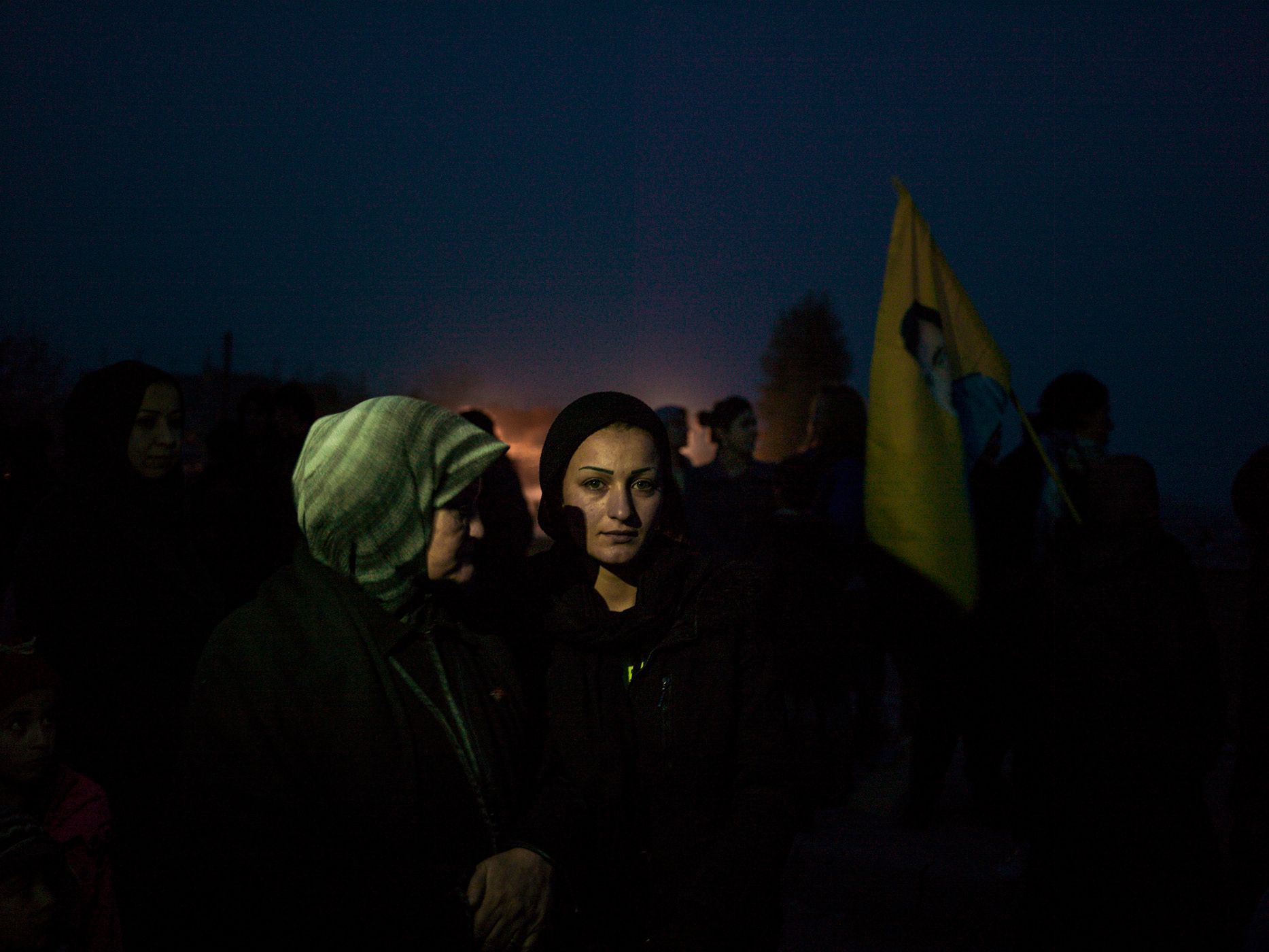 Cicek's sister, Rojin, 20, seen during the PYD promotional call for new members for YPJ and YPG in a street in Derek town. The megaphone played revolutionary music and the speaker kept talking about the freedom spirit and the Kurdish democracy."My sister was very naive and sensitive when she left us. But four years later, when she came back to bury the body of her friend who had been killed in Kobane, she was smart and tough and I could see lots of self-confidence in her eyes. When my mother told her 'please don't go back, stay with your mother', she answered 'I left to fight for all the mothers of the world. I cannot stay here'. When she came back for her friend's burial, she briefly visited the house. She kept taking pictures in every corner and with all of us, as if it was her the last party of her life." 30.jpg