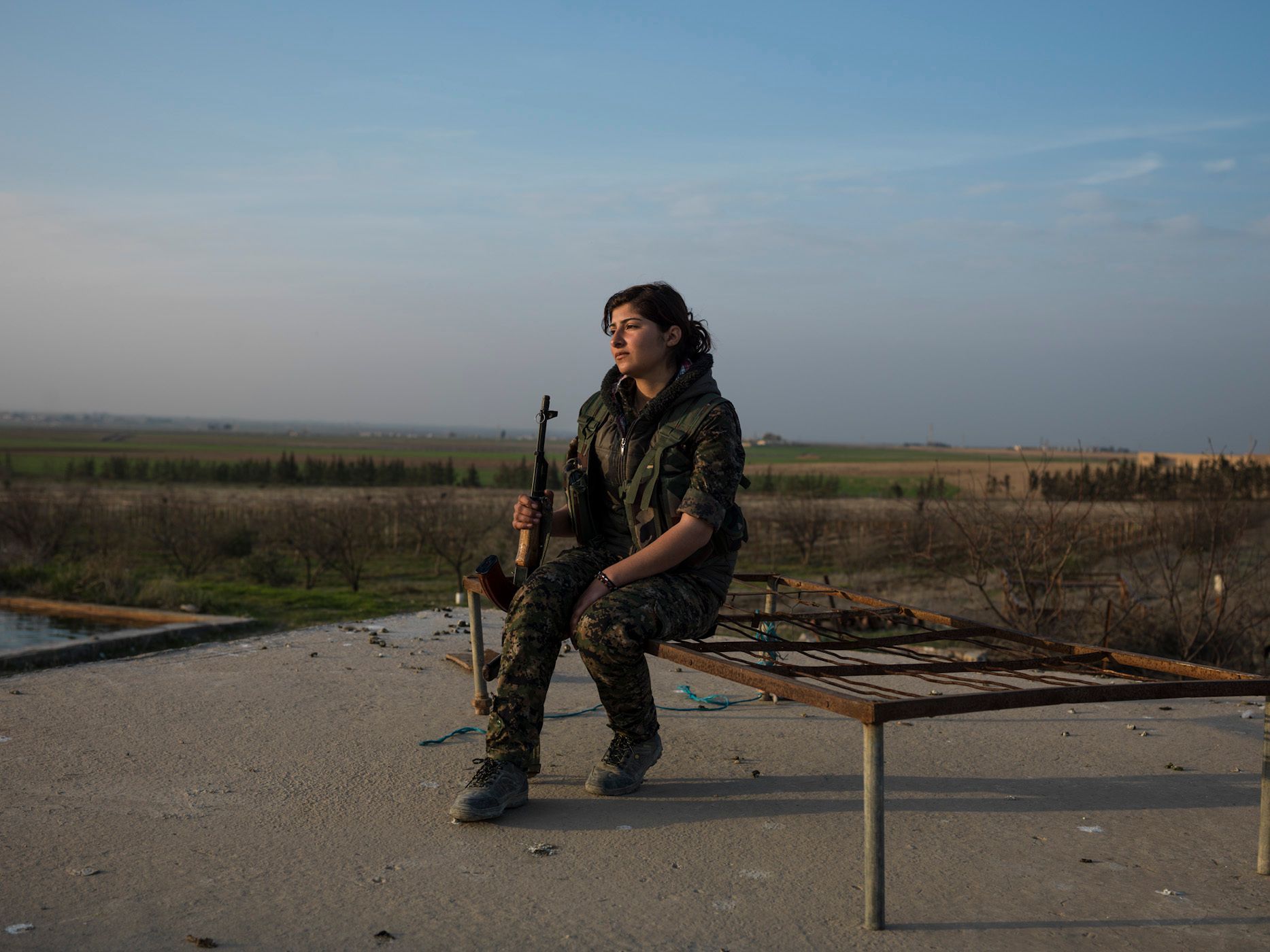 Fidan Dilow, 19, from Amuda."I joined YPJ in 2011. When I saw young girls fighting with guns in their hands, I wanted to be brave like them. For me that was important because they were women who knew why and for what they were fighting. I think that, as a female soldier, I have a very important role, especially in our society where everyone thinks that women should stay at home. The first time I went to the frontline, I was scared when my comrades asked me to shoot. But when I did, I felt so powerful. When I saw an ISIS fighter up close, I felt hatred with my whole body and soul, because I rememberd the eyes of my best friend, who was killed by them. I did not feel comfortable with my family at all. I had no closeness with my siblings and always felt lonely. But now here, I have found my family. These are all girls who think like I do. My life is so beautiful now." 15.jpg