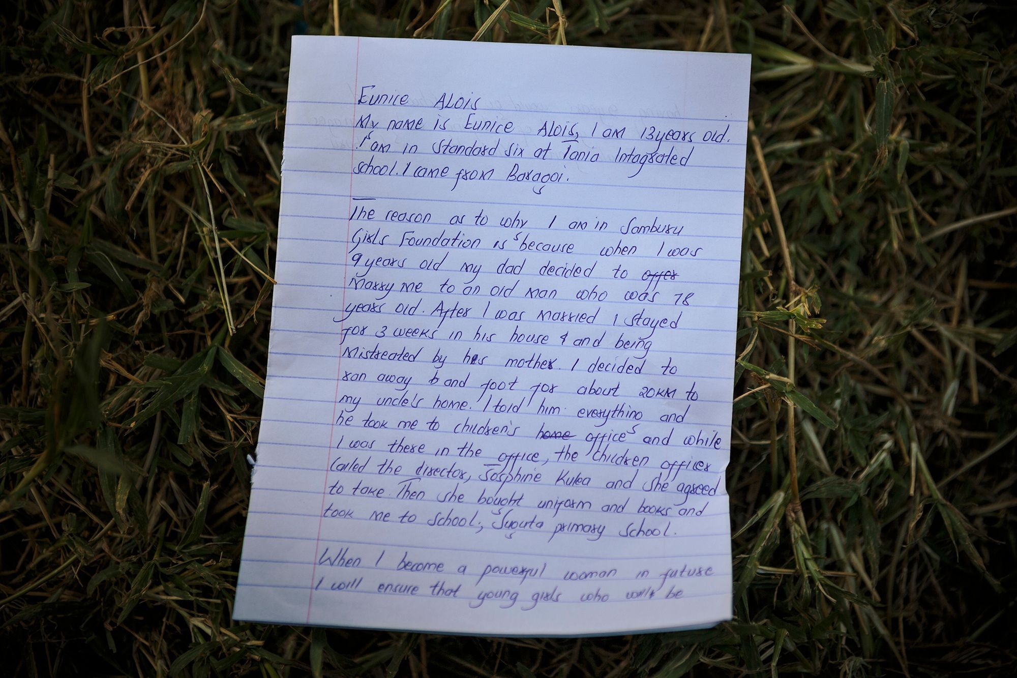 A letter written by Eunice, 13, is shown on the grounds of the facility. 21.jpg