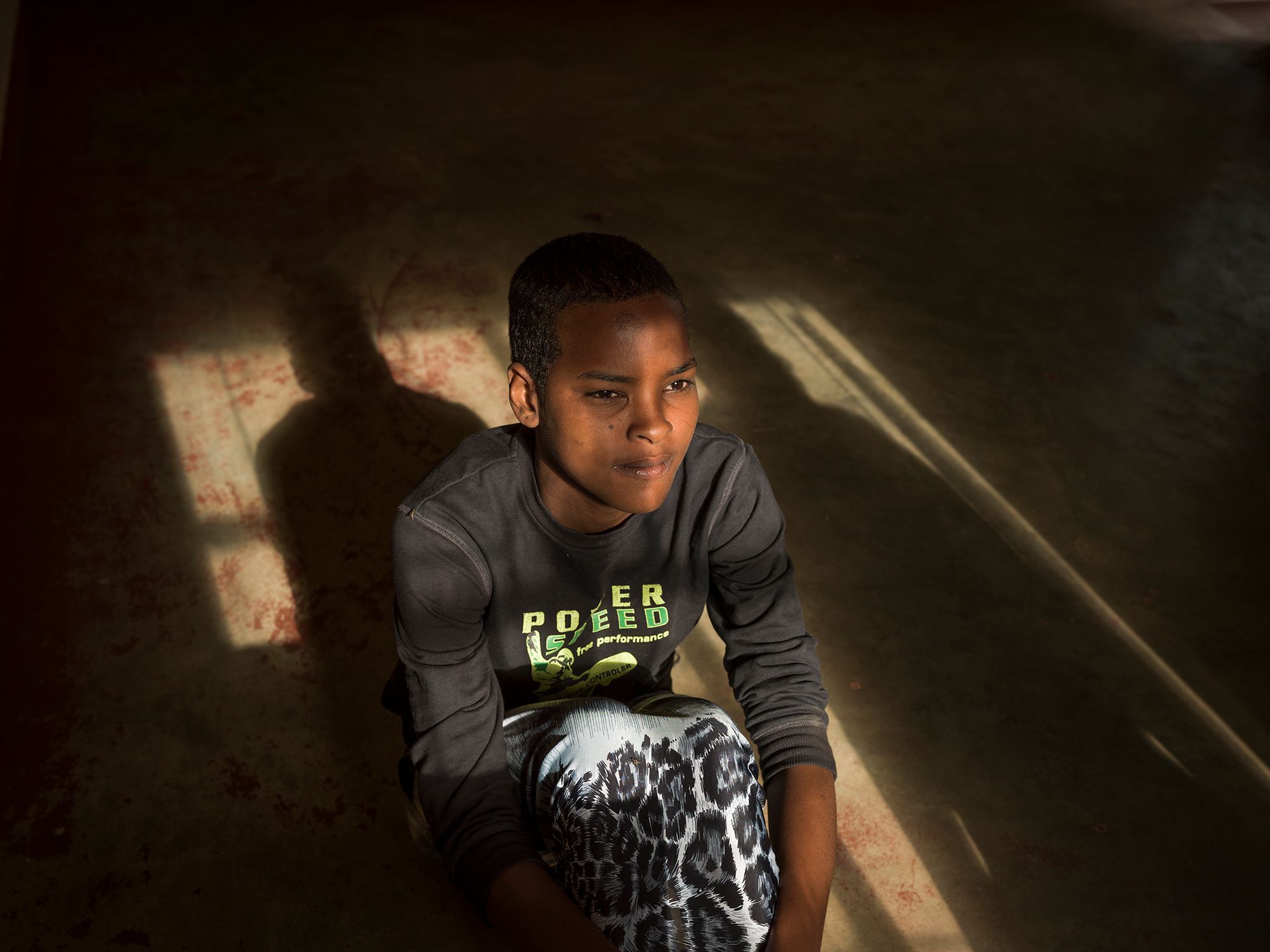 Immaculate, 13, sitting on the floor in the safe house. She is a victim of FGM. 18.jpg
