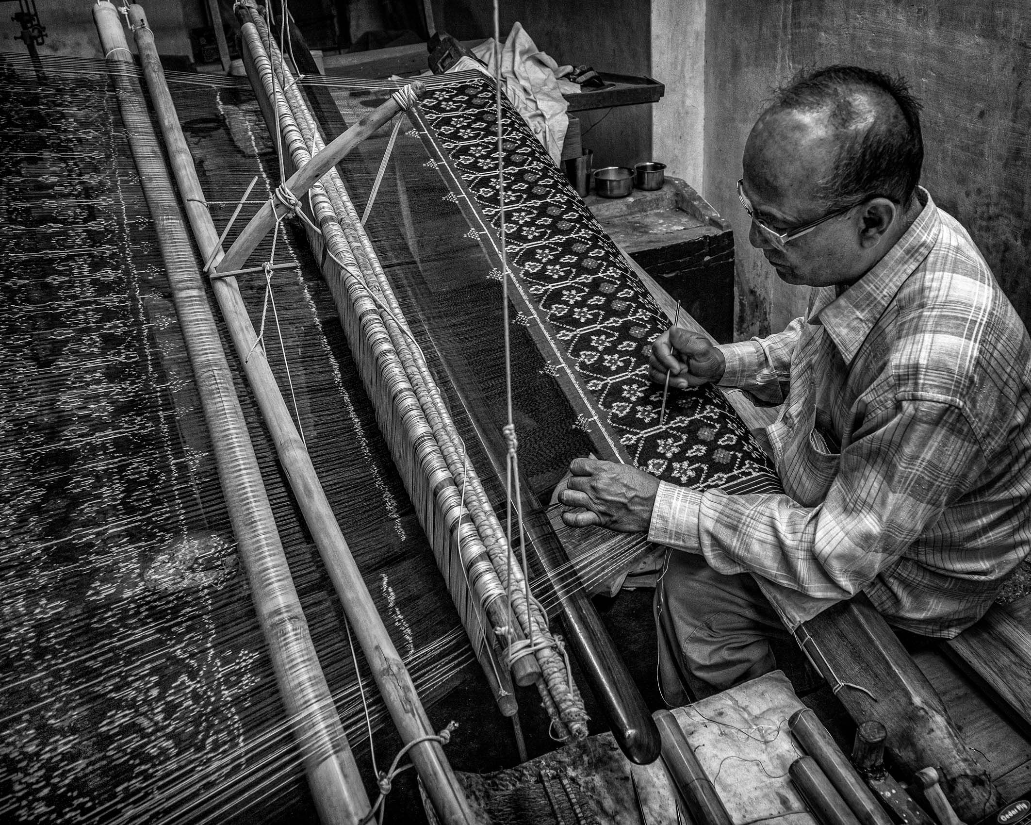 Weaver in the only remaining workshop to produce Patola double ikat woven silk textiles (Patan, Gujarat) work.textiles-21.jpg